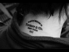a woman with a tattoo on her neck that says, there is no new york