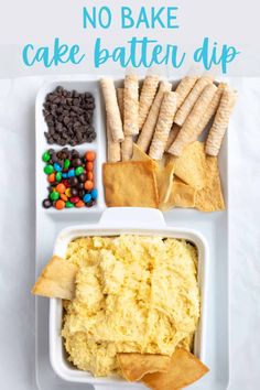 a white plate topped with rice and crackers next to a bowl filled with dip