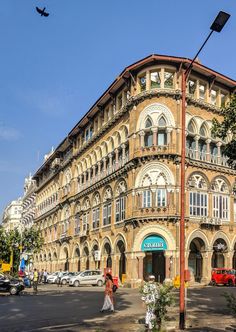 an old building on the corner of a street