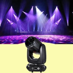 an image of a stage light show with purple lights on the side and yellow background