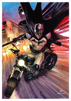 a batman riding on the back of a motorcycle