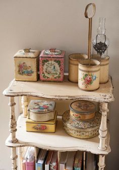 an old white shelf with some decorative items on it