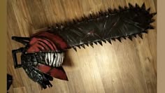 an odd looking object on the floor with spikes and chains attached to it's body