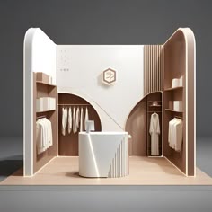 a white room with shelves and clothes on display