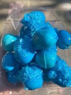 there are blue candies in the plastic container