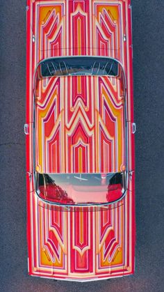 an overhead view of a red and yellow car
