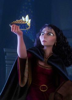 a woman in a red dress holding up a golden tiara to the side with her right hand