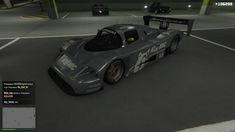 an image of a race car in the middle of a parking lot at night time