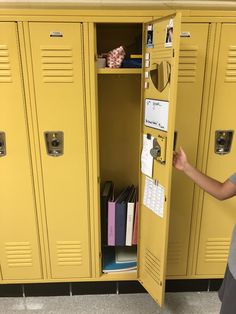 a person standing in front of a yellow locker