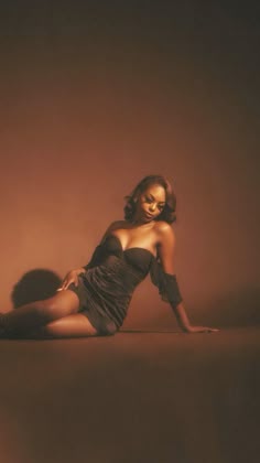 a woman is posing in a short dress