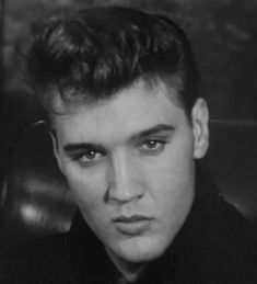 a black and white photo of a young man