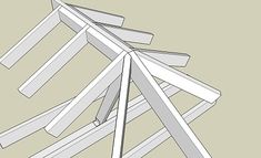 several pieces of wood sitting on top of each other in the shape of a triangle