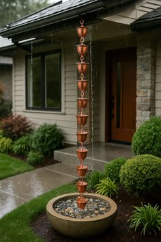 a water fountain in front of a house