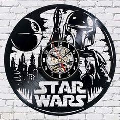 a star wars themed clock on a white brick wall