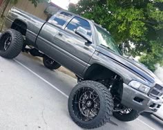 a large gray truck parked in a parking lot