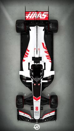 an aerial view of a racing car on a gray background with red and white stripes