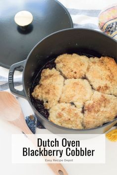 dutch oven blackberry cobbler in a cast iron skillet