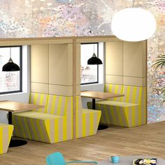 a room with tables and chairs in it