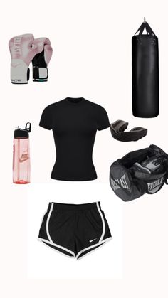 a woman's black outfit with boxing gear