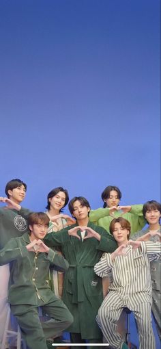 the group of young men are posing for a photo