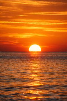 the sun is setting over the ocean and it looks like it's going to be gone