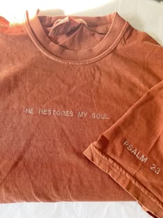 an orange shirt that says, the restons my soul is palm 23 on it