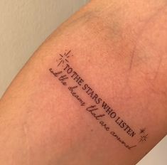 a person with a tattoo on their arm that says, to the stars who listen