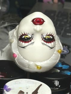 a white mask sitting on top of a table