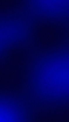 a blurry image of blue lights in the dark