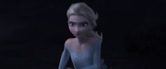 an animated figure sitting in the dark with one hand on her hips and two hands behind her head