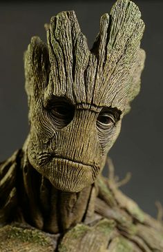 a close up view of the face and head of a groote from avengers