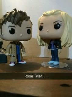 two figurines are sitting on a table with the caption rose tyler, i