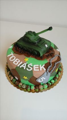 a birthday cake with a tank on top
