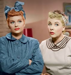 two women are standing next to each other