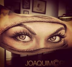 a woman's eye with long lashes and eyebrows