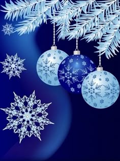three blue christmas ornaments hanging from a tree