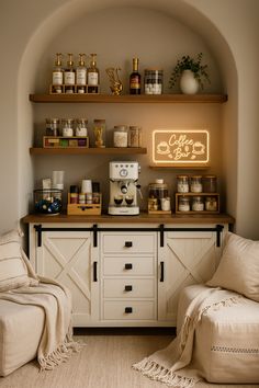 a coffee bar with two chairs in front of it and shelves on the wall above