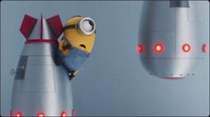 a minion sitting on top of a rocket ship next to another character in the movie despicable me