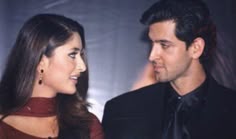 a man and woman standing next to each other