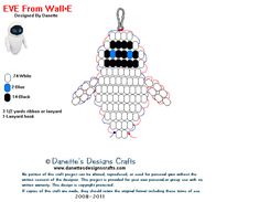 an ornament made out of black, white and blue beads with text describing eye from wall - e