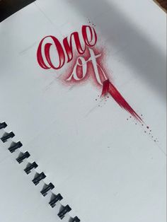 the word love is drawn on top of a piece of white paper with red ink