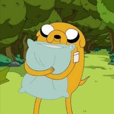 a cartoon character holding up a pillow in the woods with eyes wide open and one eye closed