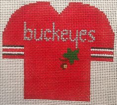 a red cross stitched heart with the words bucks on it