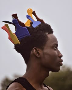 a woman with some hair combs on her head and other items in the shape of horses