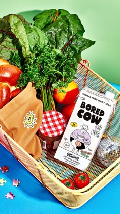 a basket filled with fruits and vegetables on top of a table