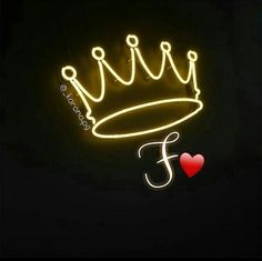 a neon sign that says f is for f with a crown on it and a red heart