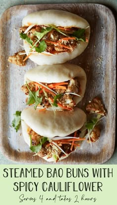 steamed bao buns with spicy cauliflower, carrots and lettuce