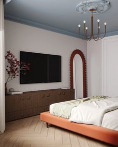 a bedroom with a bed, dresser and large mirror in it's center area