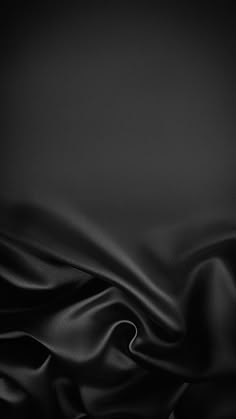 black silk textured background with soft folds
