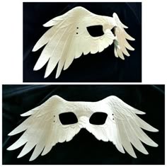 two white masks with wings on them